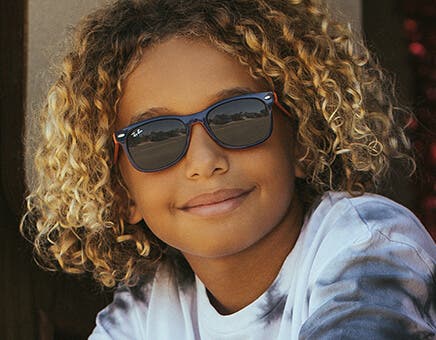 ray ban kids glasses featuring the ray ban rj9062s kids sunglasses in matte black with flash blue lenses